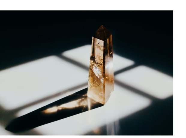 A raw amber crystal under window light